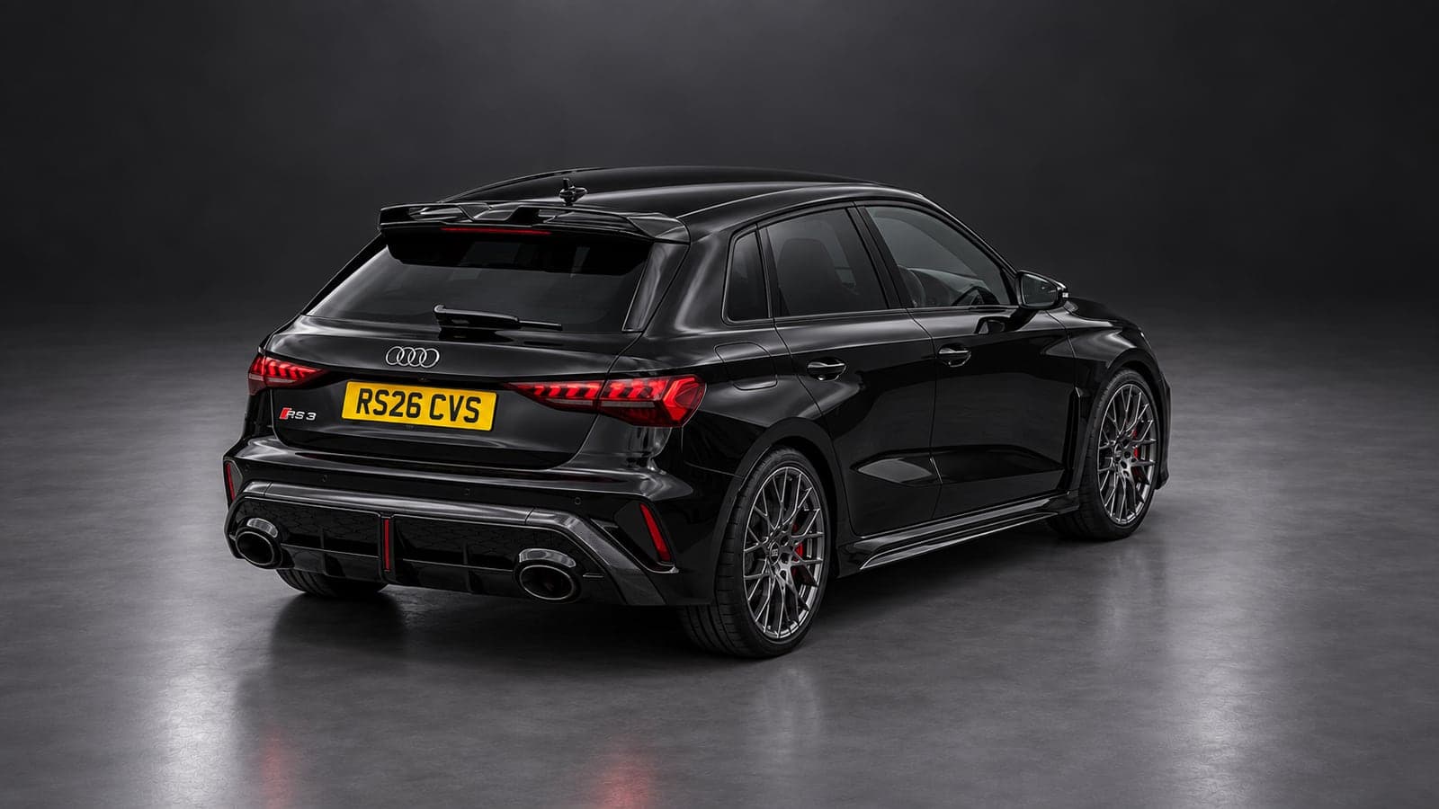 Audi RS3 Sportback — elevated rear, studio
