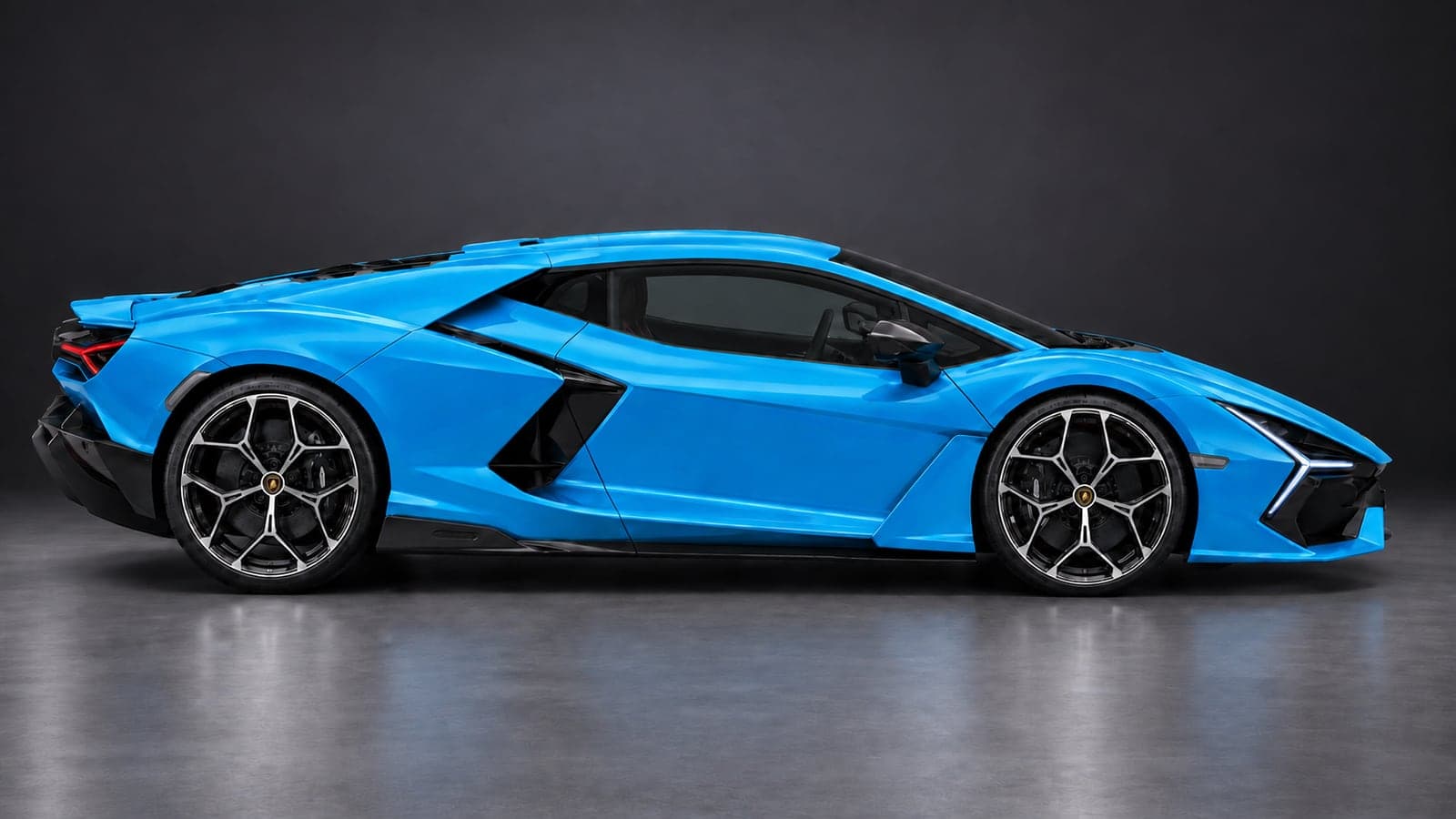 Blue Lamborghini Revuelto V12 hybrid, side profile, available to hire from CVS Car Hire