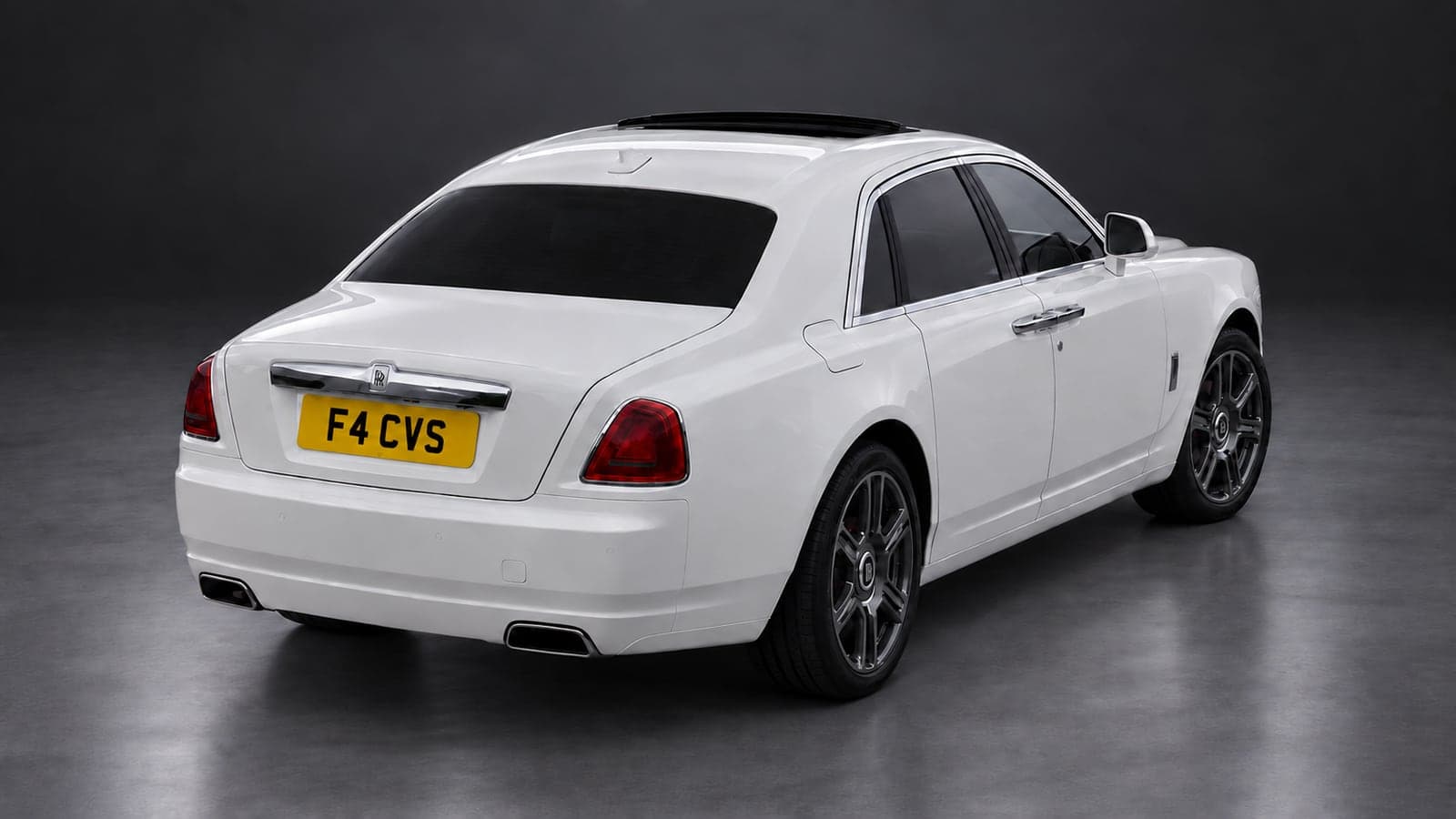 White Rolls-Royce Ghost — elevated rear, studio