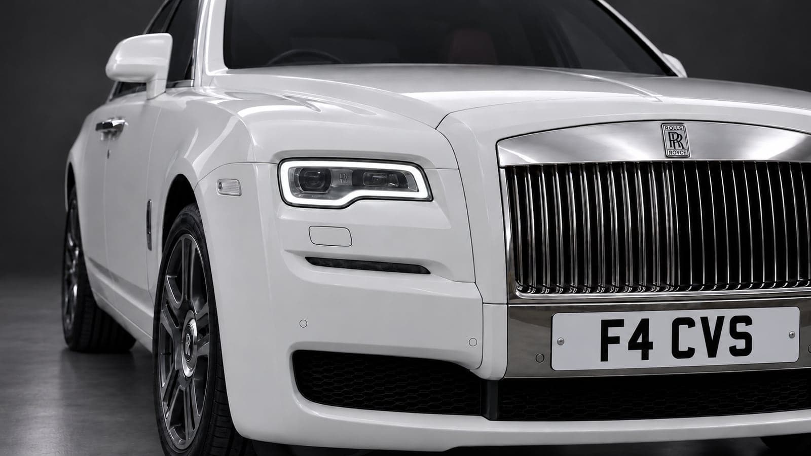 White Rolls-Royce Ghost — headlight detail