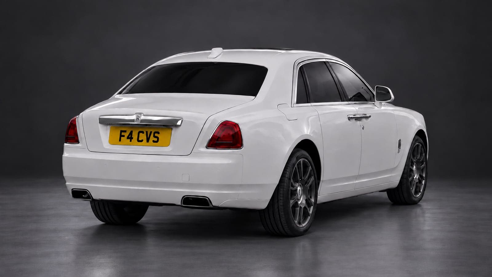 White Rolls-Royce Ghost — rear three-quarter, studio