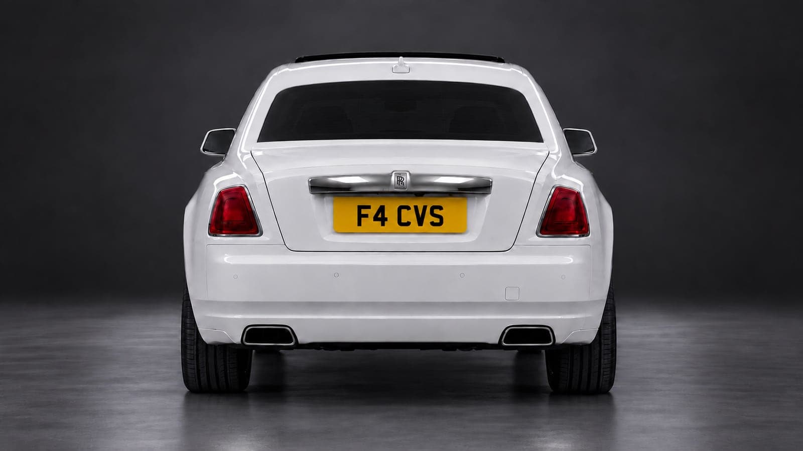 White Rolls-Royce Ghost — rear, studio