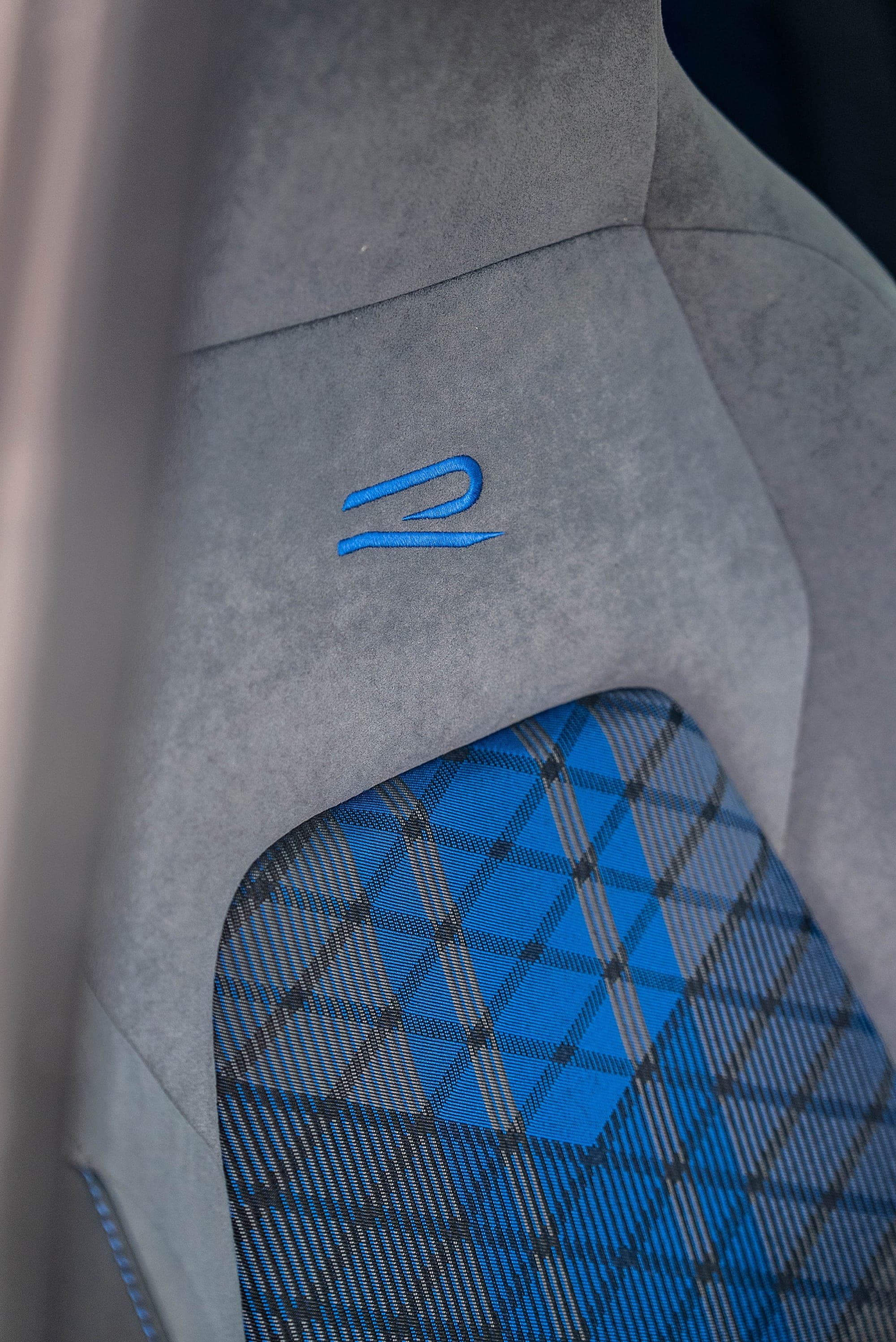Golf R seat detail with the blue R logo and diamond stitching