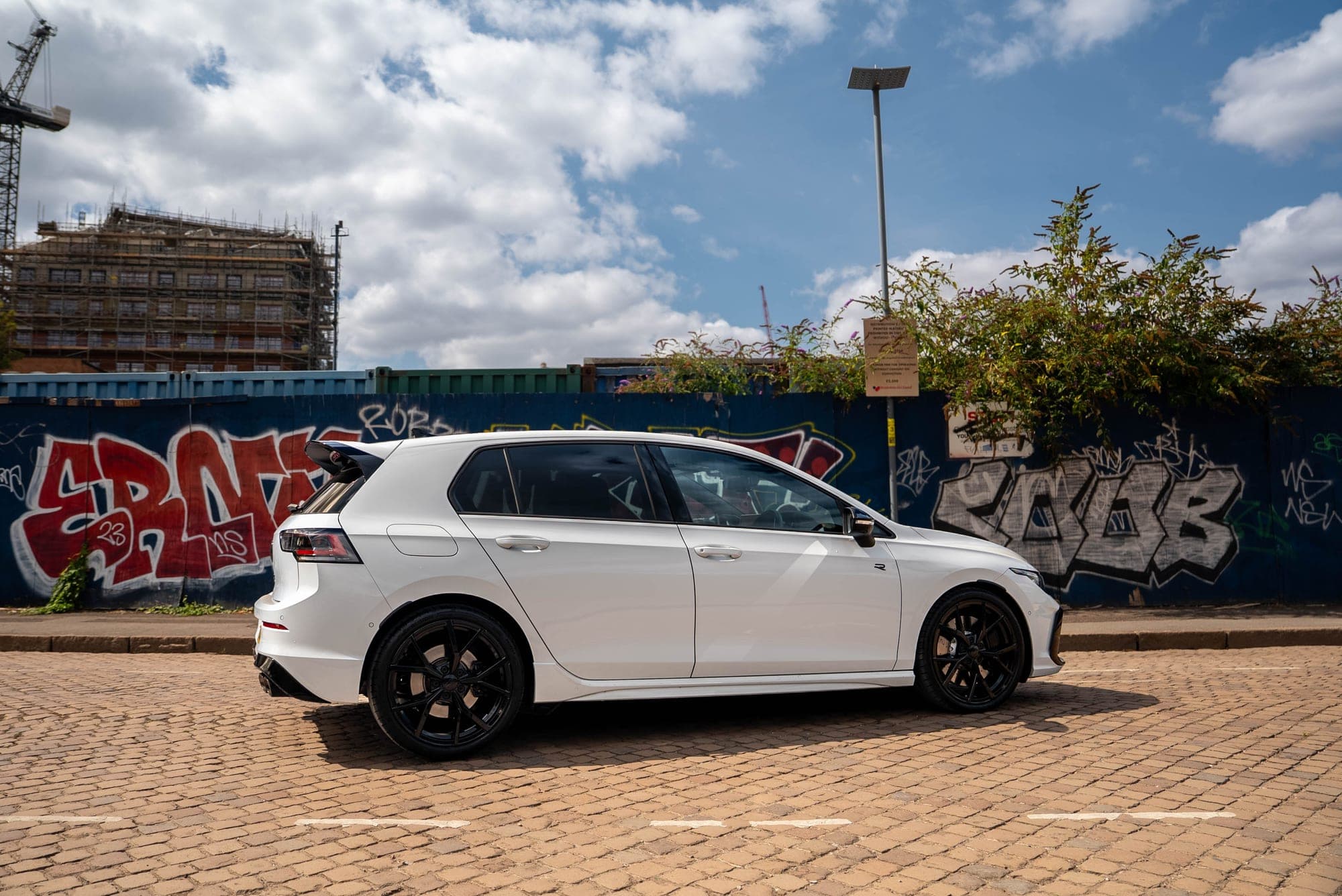 Side profile of the white Volkswagen Golf R