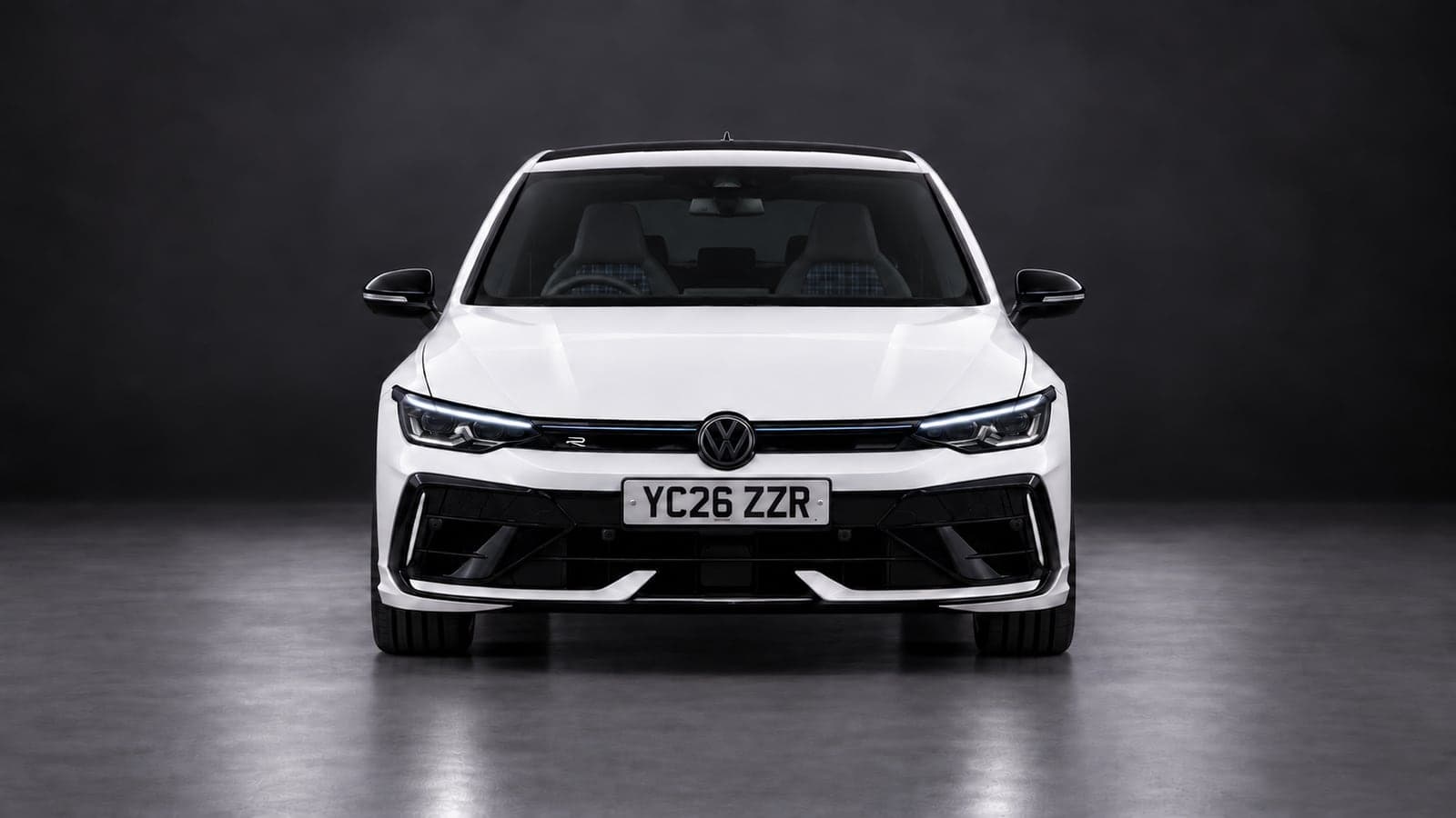 White Volkswagen Golf R — head-on, studio