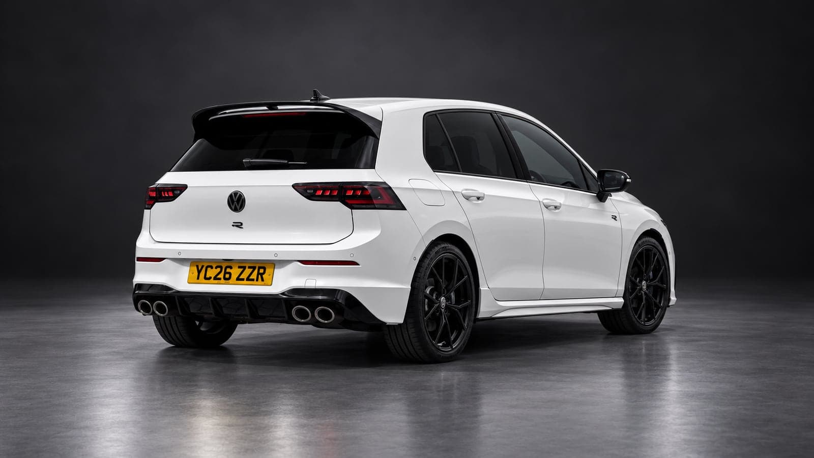 White Volkswagen Golf R — rear three-quarter, studio
