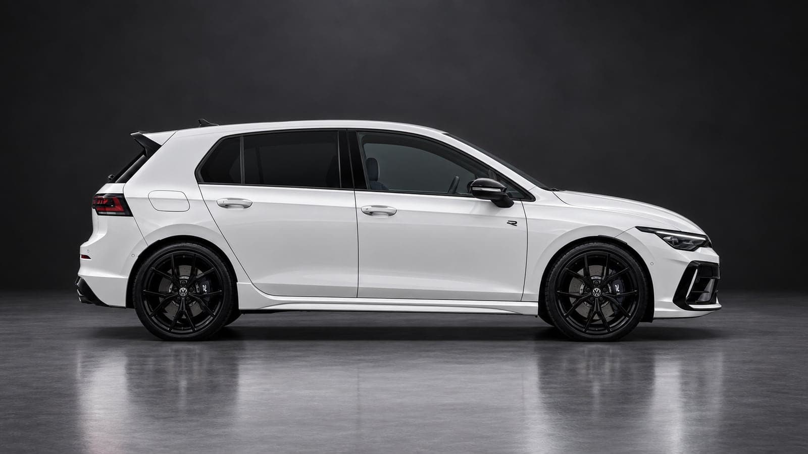 White Volkswagen Golf R — side profile, studio