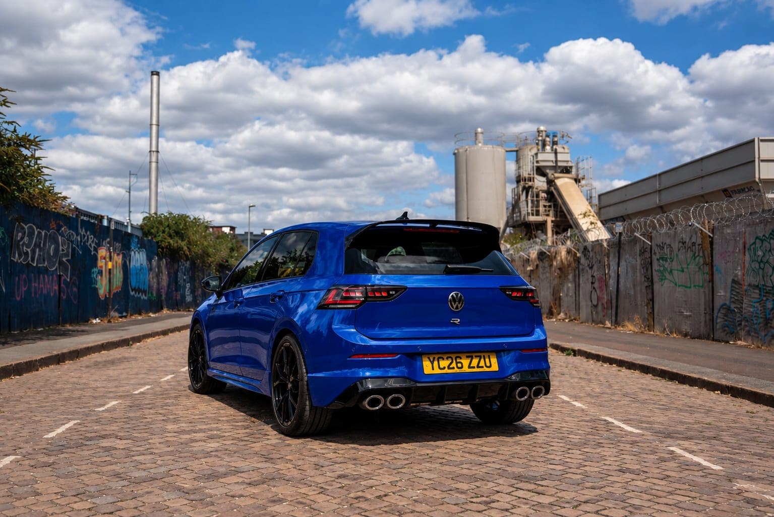 Rear of the Lapiz Blue Volkswagen Golf R with its quad exhaust