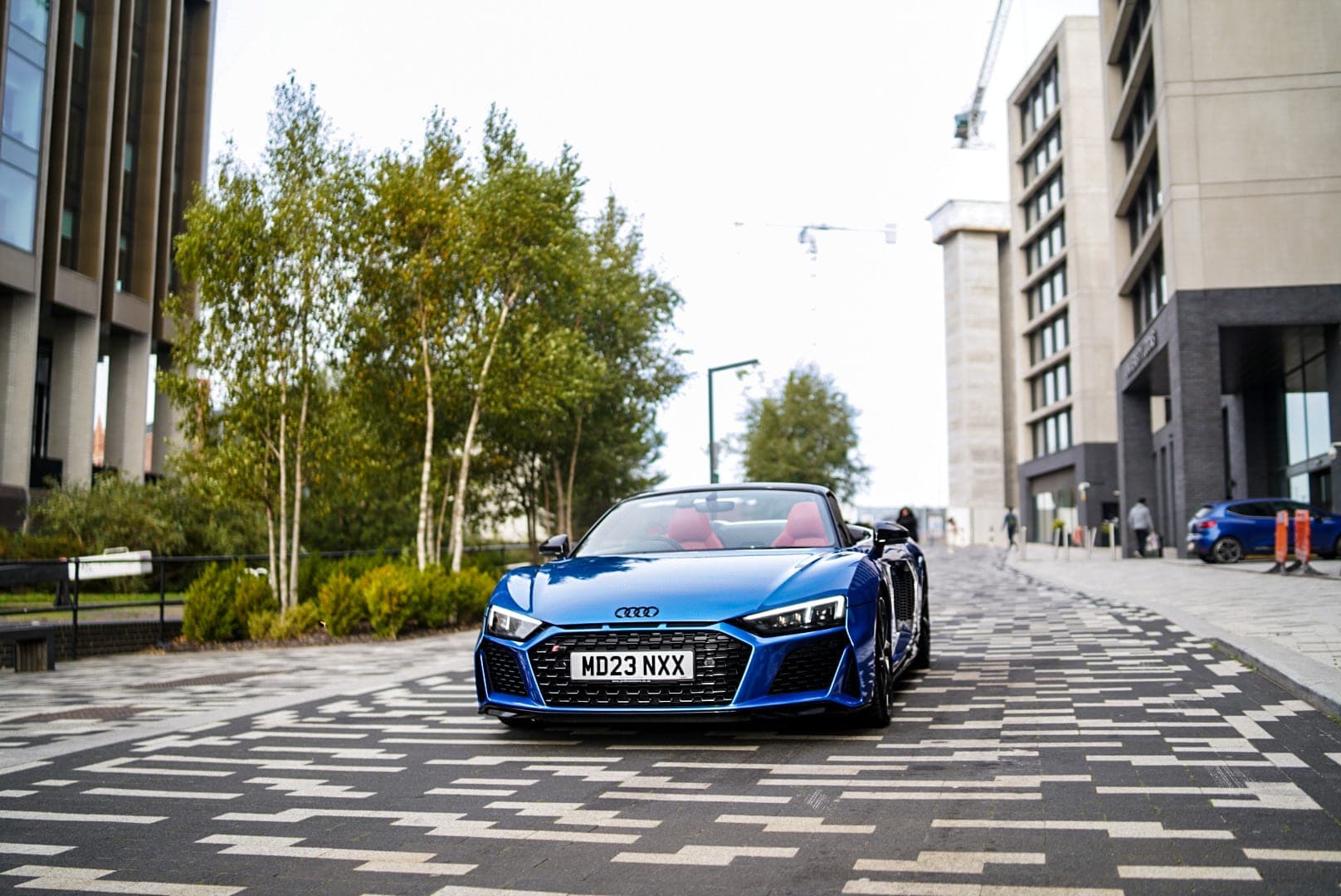 Audi R8 Spyder in the city with the roof down