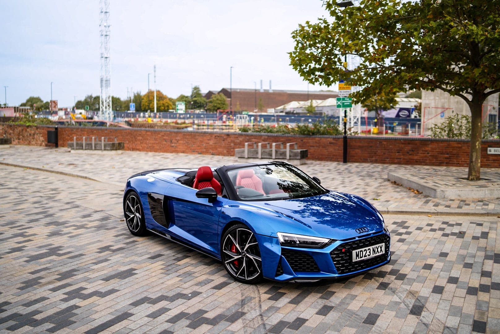 Blue Audi R8 Spyder with the roof down, available for self-drive supercar hire at CVS Car Hire Birmingham