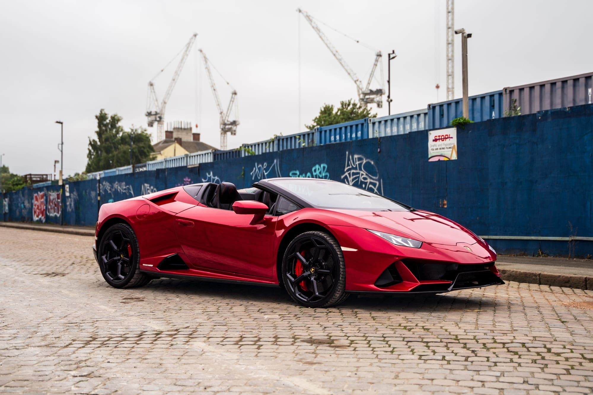 Red Lamborghini Huracán Evo Spyder with the roof down