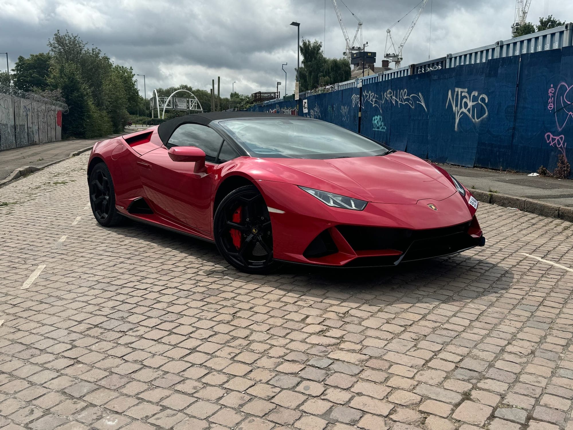Red Lamborghini Huracán Evo Spyder parked