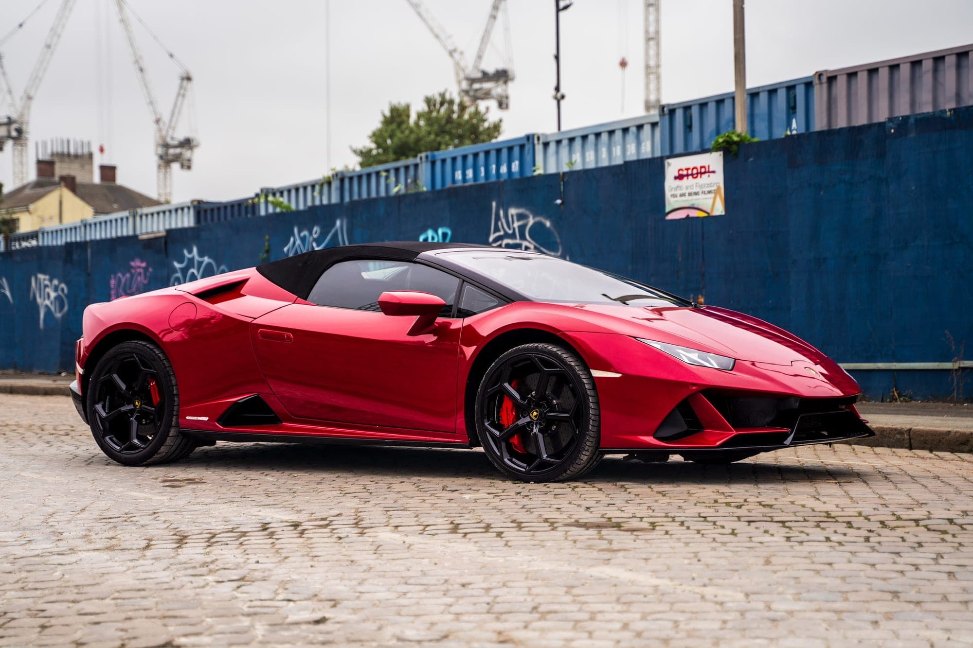 Front three-quarter view of the red Lamborghini Huracán Evo Spyder