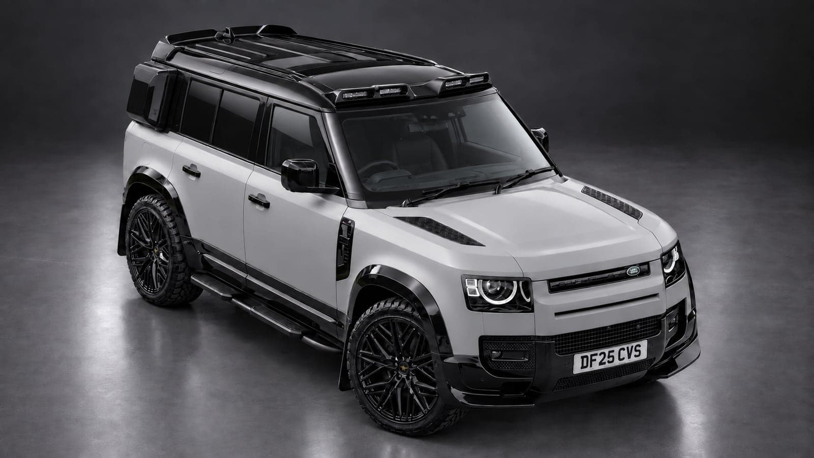 Land Rover Defender — elevated front, studio