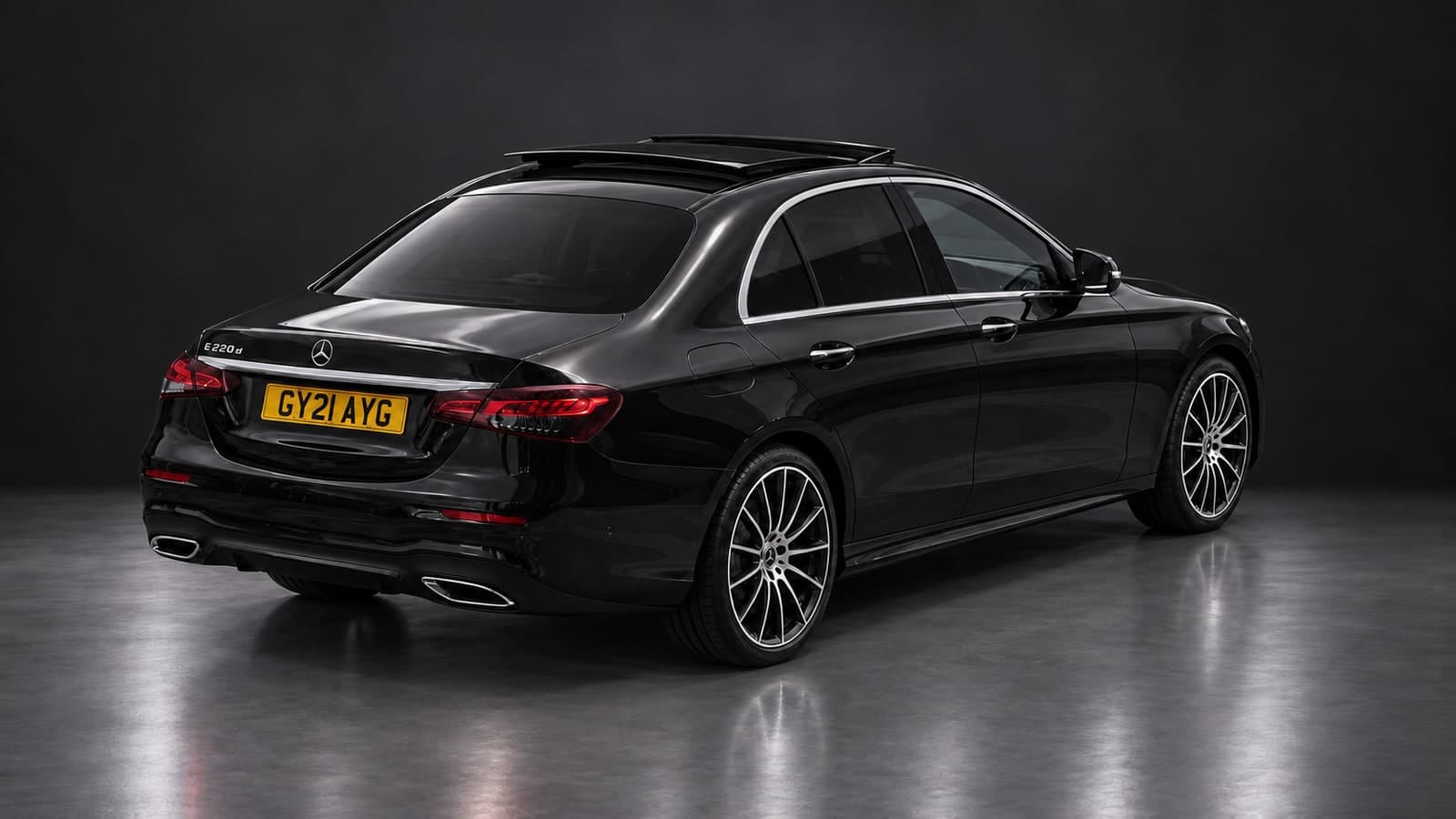 Mercedes-Benz E-Class AMG Line — elevated rear, studio