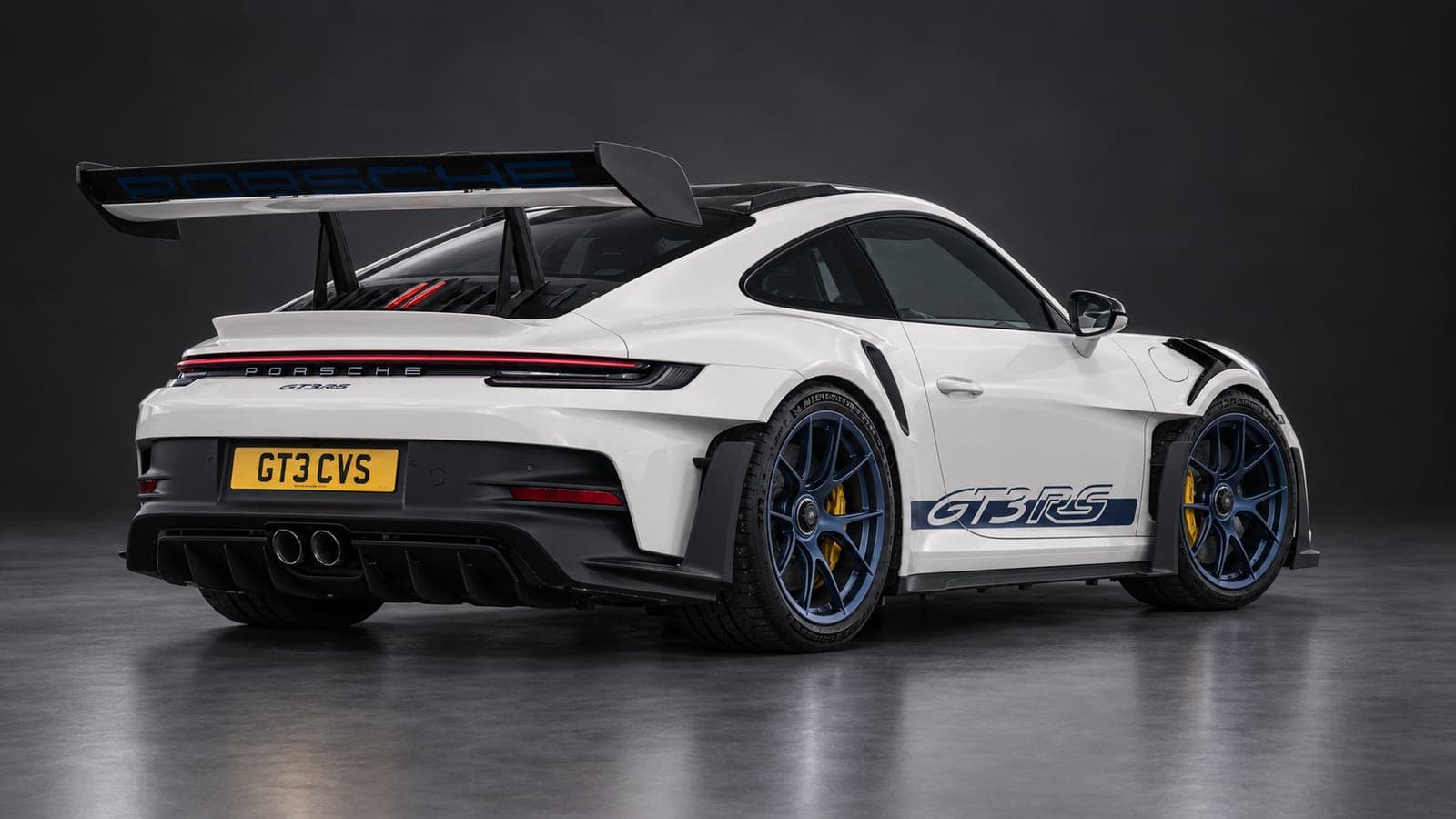 White Porsche 911 GT3 RS with its swan-neck wing, rear three-quarter, available to hire from CVS Car Hire