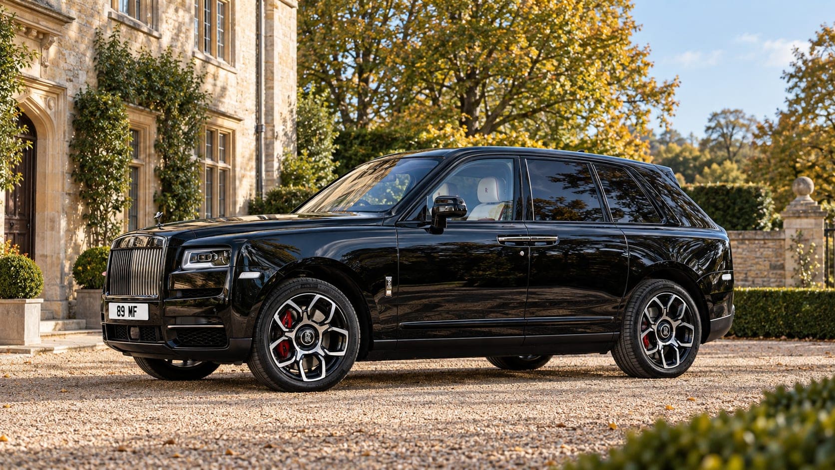 A Rolls-Royce Cullinan wedding car at a country manor