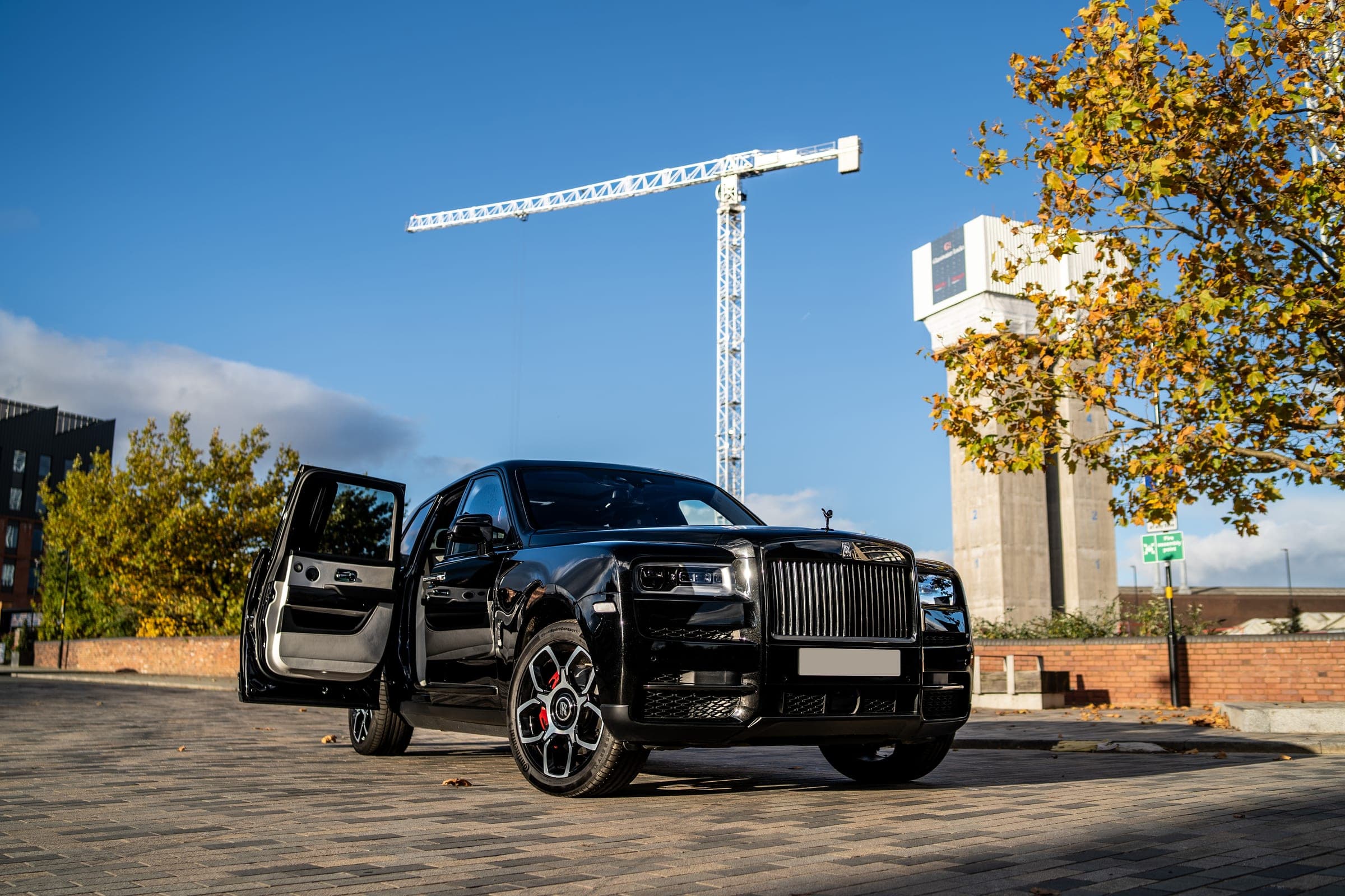 Rolls-Royce Cullinan with its rear coach door open, for luxury SUV and chauffeur hire at CVS Car Hire