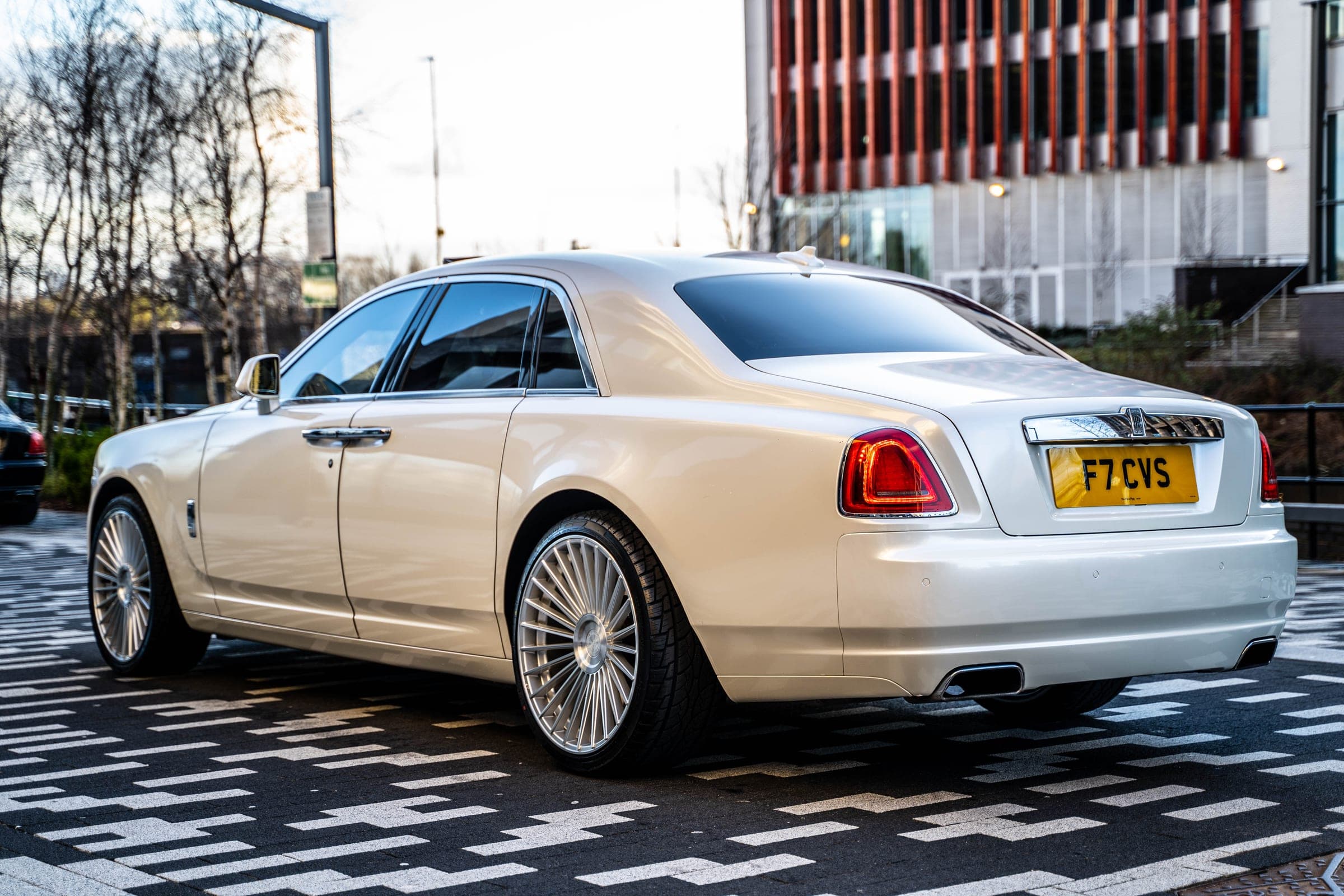 Rear three-quarter view of the champagne Rolls-Royce Ghost